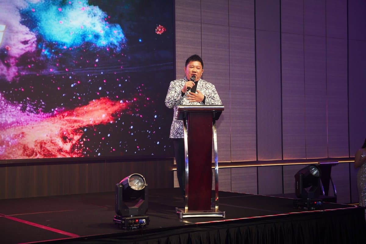 Low Tung speaking at a company event.