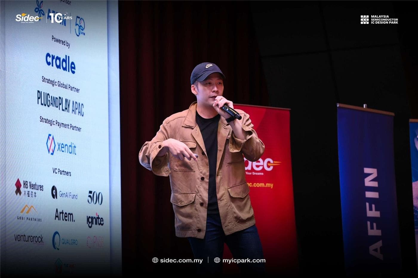 A speaker presenting at a technology event featured in the Corplabs company brief