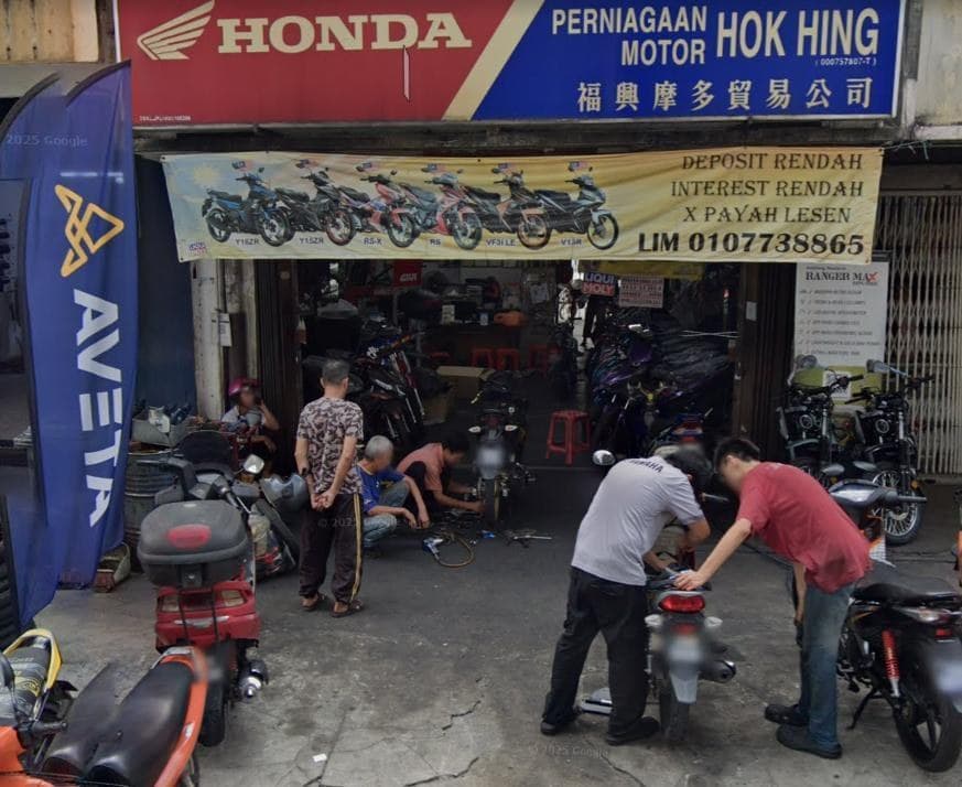 Motorcycle servicing outside the Hok Hing Motor shop in Kepong